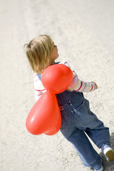 Girl ( 3-4 ) holding bunch of balloons, rear view - SMOF00091