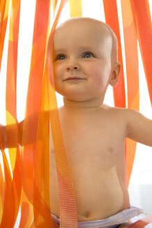 Baby boy (6-12 months) by plastic curtain - SMOF00027