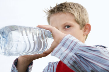 Boy (10-12) drinking from water bottle - RDF00197