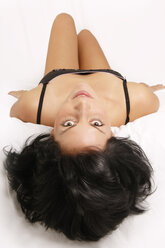 Young woman lying on bed - 00178LR-U