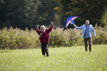 Father and son flying kite - WESTF03124