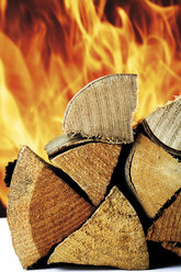 Piled firewood, fire in background - 05507CS-U