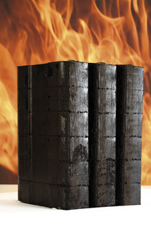 Piled briquettes, fire in background - 05473CS-U