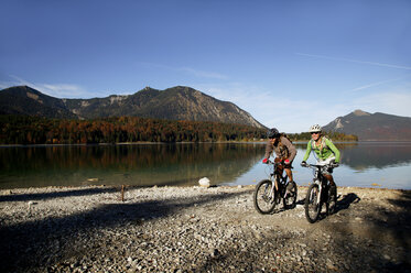 Germany, Bavaria, Couple mountain biking - MRF00792