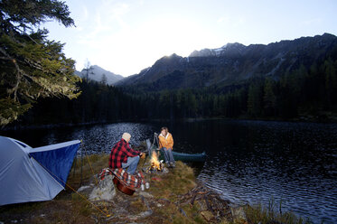 Man and woman camping at lake - HHF00937