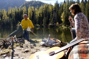 Man and woman camping at lake - HHF00923