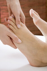 Woman receiving foot massage - WESTF03257