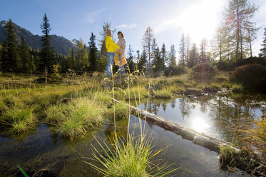 Couple in mountains, embracing - HHF01089