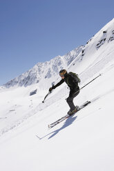 Austria, Tyrol, person telemark skiing - FFF00758