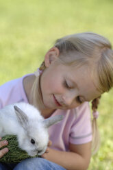 Girl holding easter bunny - CRF01085