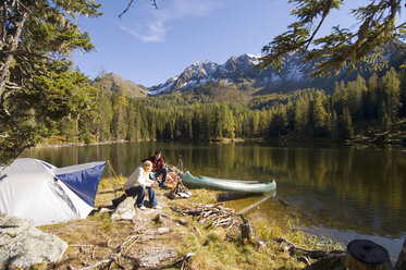 Young couple camping at lake - WESTF04357