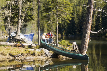 Young couple camping at lake - WESTF04347