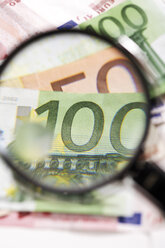 Euro banknotes under magnifying glass, close-up - 06039CS-U