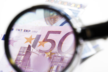 Euro banknotes under magnifying glass, close-up - 06037CS-U