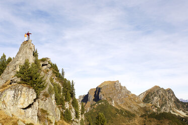 Couple standing on summit - WESTF04241