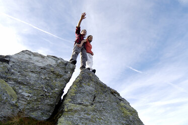 Couple standing on summit - WESTF04226