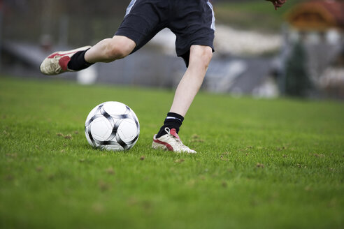 Boy (12-13), playing football - WWF00268