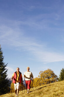 Senior couple Nordic walking outdoors - WESTF04294