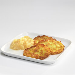 Potato fritters with apple sauce on plate - WESTF04624