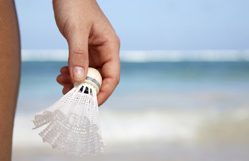 Woman holding shuttlecock, close-up - PKF00037