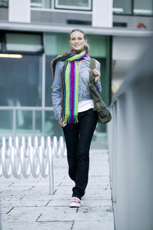 Young woman wearing scarf, walking - KMF00992