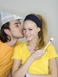 man with shako kissing woman, holding brush - WESTF05201