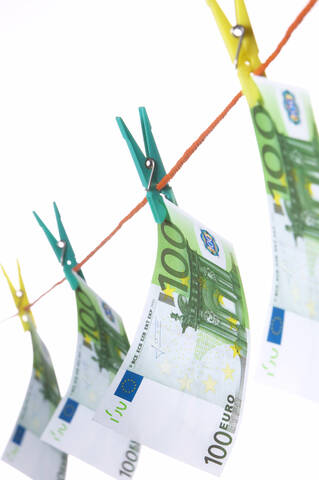 Hundred euro notes on clothesline, close-up stock photo