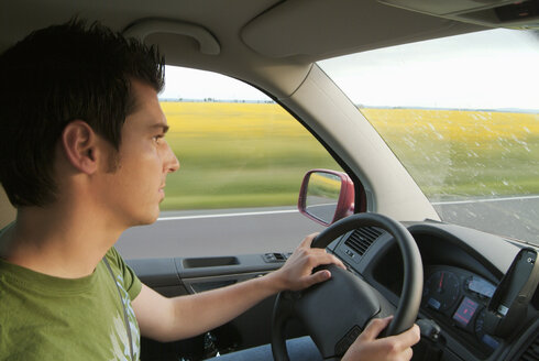 Man driving car, side view - PKF00049