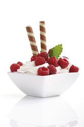 Rasberries on whipped cream in bowl, close-up - 06885CS-U