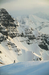 Austria, Kleinwalsertal, Man skiing in Alps - MRF00927
