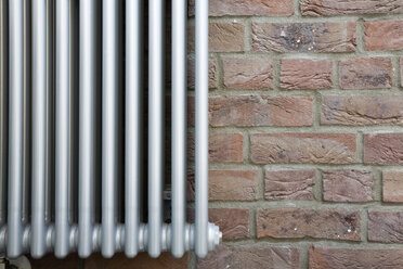 Radiator on brick wall, close-up - GWF00480