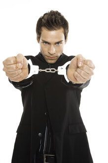 Young man with handcuffs, close-up - PKF00178