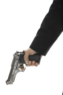 Young man holding hand gun, close-up - PKF00144