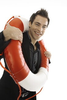 Young man carrying life belt, close-up - PKF00133