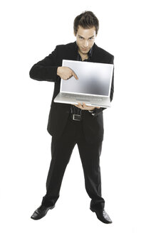 Young man holding laptop, close-up - PKF00128