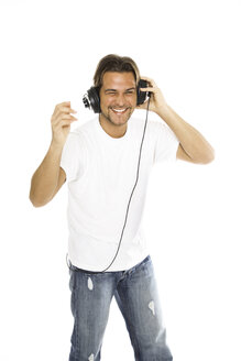 Man using headphones, portrait - PKF00103