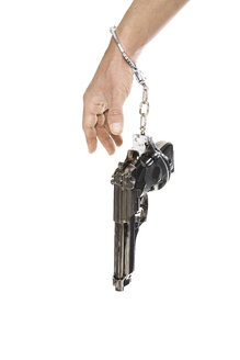 Pistol hanging on arm, close-up - PKF00101