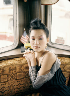 Asian woman in van, portrait - PK00216