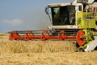 Germany, Bavaria, Combine harvester harvesting wheat - MAEF00441