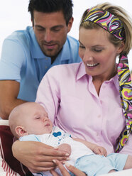 Parents with baby in garden - WESTF06176