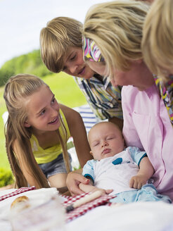 Family in garden with baby - WESTF06171