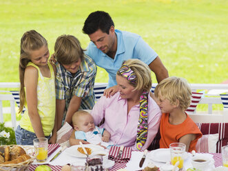 Family in garden with baby - WESTF06169