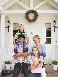 Family in front of house - WESTF06158