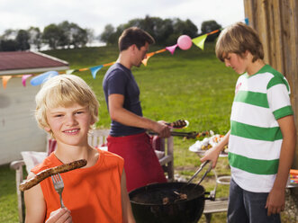 Family in garden, having barbecue - WESTF06075