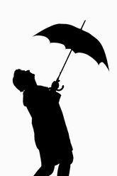 Man holding umbrella, silhouette - CRF01306