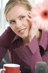 Woman sitting in office, thinking - VRF00049