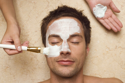 Germany, man getting a facial, close-up - BABF00360