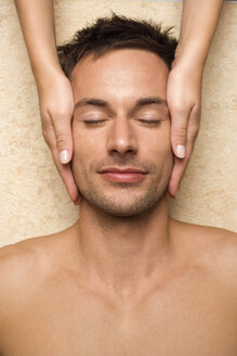 Germany, man receiving facial massage, close-up - BABF00355