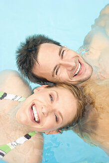 Germany, couple relaxing in swimming pool, portrait, close-up - BABF00339
