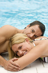 Germany, young couple at swimming pool, close-up - BABF00323